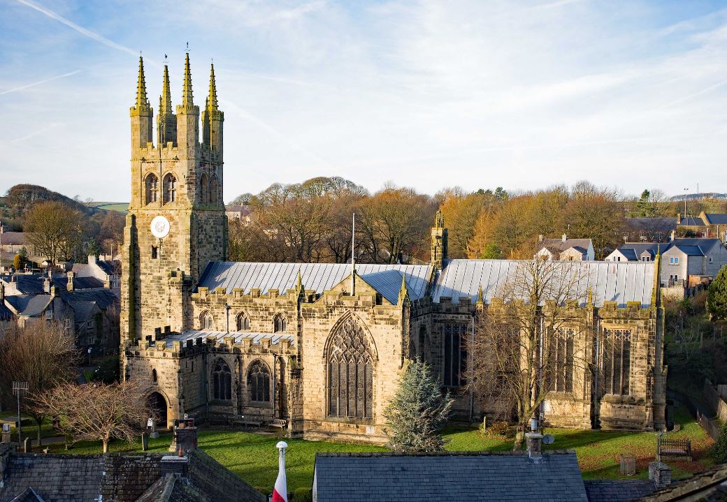 The tall windows of the Chancel and Transept seen from the churchyard